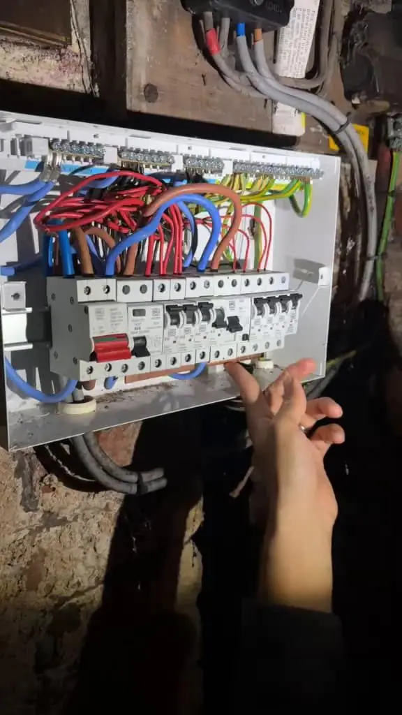 Electrician fault-finding at a consumer unit on a callout